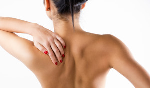 Young Woman With Pain In Her Back